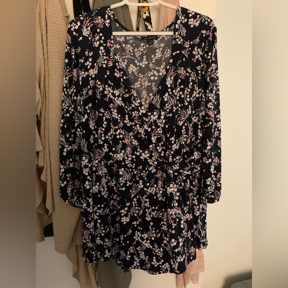 Lane Bryant size 26/28 navy, floral peplum blouse with 3/4 sleeves.